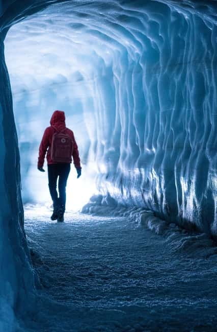 From Húsafell: Into the Glacier Ice Cave Adventure - Inside the ice tunnel: blue hues, ash layers, and real glacier science