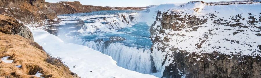 From Reykjavik: Golden Circle & Secret Lagoon Day Tour - From Faxi waterfall to Geysir: mud pits, hot steam, and Strokkur’s show