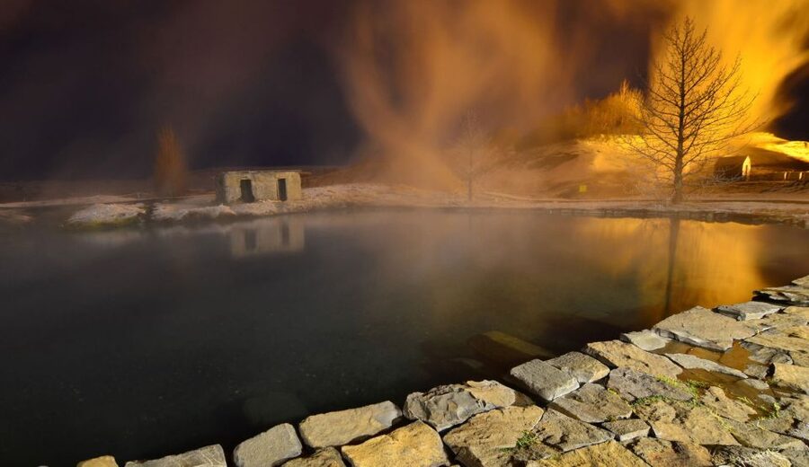 From Reykjavik: Golden Circle & Secret Lagoon Guided Tour - Geysir area, standing close to an eruption