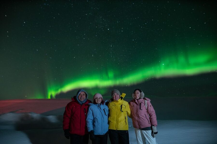 From Reykjavik: Northern Lights Guided Tour with Photos - Driving out for darker skies, then chasing or waiting