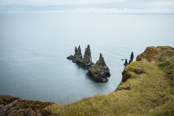 Private South Coast with Glacier Hike in Iceland - Reynisfjara black sand beach and Dyrhólaey: raw coast stops that change with the light