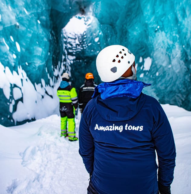 Reykjavík: Langjökull Glacier Snowmobile Tour with Ice Cave - Entering the ice cave on Langjökull: blue ceiling, ash stripes, and cautious steps