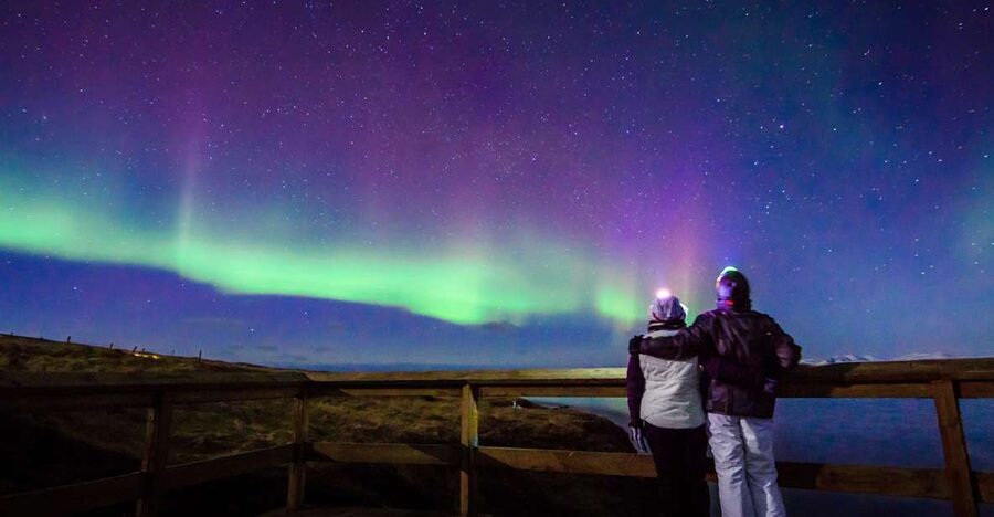 Reykjavík: Northern Lights Minibus Tour with Photos - From Reykjavík Lights to a Real Aurora Hunt