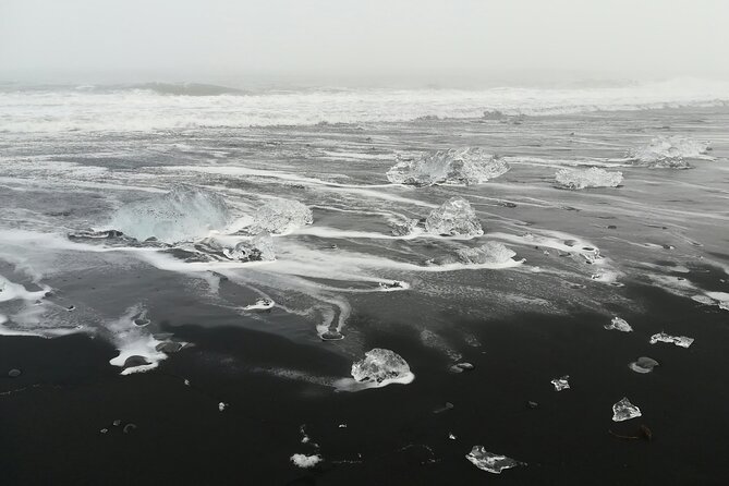 Shared Group Glacier Lagoon Tour from Djupivogur - Diamond Beach: ice on the sand, close enough to feel the scale