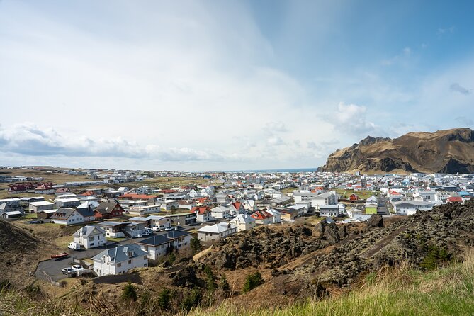 Vestmannaeyjar, Puffins & Volcanoes Small Group Day Tour - Skansinn and Stafkirkjan: harbor history plus quick church beauty
