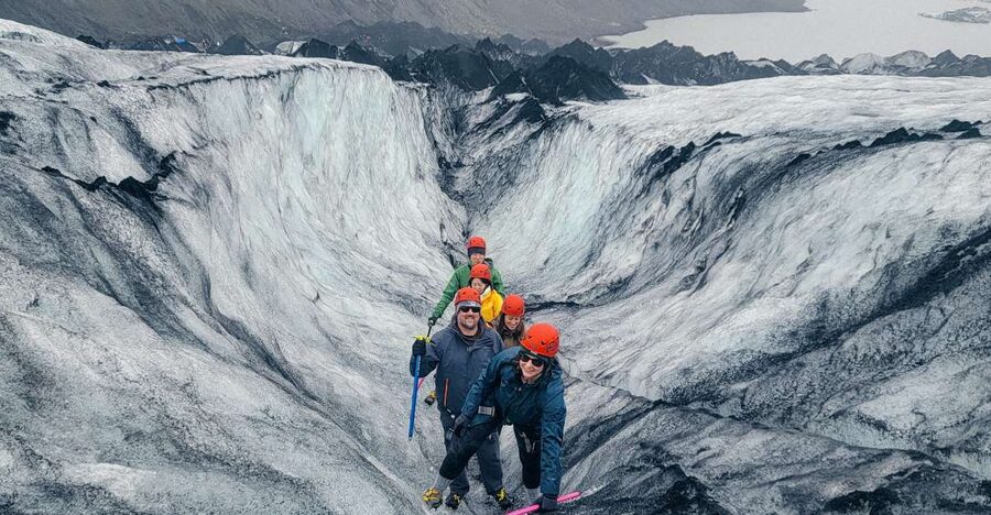 Vik: Guided Glacier Hike on Sólheimajökull - Gear handoff at base camp: harness, helmet, crampons, ice ax